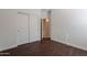 Cozy bedroom with wood-look flooring and a sliding-door closet at 5026 E Sunstone Dr, San Tan Valley, AZ 85143