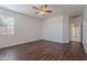 Spacious bedroom with wood floors, ceiling fan, and natural light at 5026 E Sunstone Dr, San Tan Valley, AZ 85143