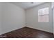 A cozy bedroom features a wood floor and a bright window at 5026 E Sunstone Dr, San Tan Valley, AZ 85143