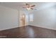 A spacious bedroom shows archway to bathroom and bright window at 5026 E Sunstone Dr, San Tan Valley, AZ 85143