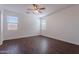 A bright bedroom with a ceiling fan and sleek wood flooring at 5026 E Sunstone Dr, San Tan Valley, AZ 85143