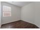Spare bedroom featuring wood-look flooring and a window with blinds at 5026 E Sunstone Dr, San Tan Valley, AZ 85143