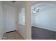 Bright foyer featuring a tiled floor, white door, and an arched doorway leading into another room at 5026 E Sunstone Dr, San Tan Valley, AZ 85143