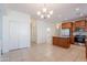 Open kitchen/dining area, features a kitchen island, stainless appliances, and tile flooring at 5026 E Sunstone Dr, San Tan Valley, AZ 85143