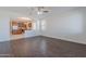 View of the living space featuring dark wood flooring and kitchen area at 5026 E Sunstone Dr, San Tan Valley, AZ 85143
