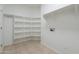 Bright pantry offers ample storage with multiple shelves and neutral-toned tile floor at 5026 E Sunstone Dr, San Tan Valley, AZ 85143