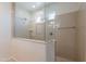 Shower with glass partition, tiled walls, and natural light at 5026 E Sunstone Dr, San Tan Valley, AZ 85143