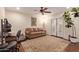 Cozy bedroom with hardwood floors, a comfortable couch, ample workspace, and bright French doors at 5402 E Larkspur Dr, Scottsdale, AZ 85254
