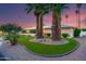 Landscaped front yard featuring desert plants, and synthetic grass at 5402 E Larkspur Dr, Scottsdale, AZ 85254