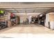 Spacious two-car garage with ample storage space and shelving units at 5402 E Larkspur Dr, Scottsdale, AZ 85254
