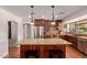 Kitchen with a large island, stainless steel appliances, and pendant lighting at 5402 E Larkspur Dr, Scottsdale, AZ 85254