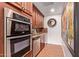 Additional kitchen area with stainless steel appliances, built-in microwave and granite countertops at 5402 E Larkspur Dr, Scottsdale, AZ 85254