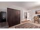 Bright room featuring built-in storage, workspace, and doorway leading to other living spaces at 5402 E Larkspur Dr, Scottsdale, AZ 85254