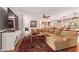 Spacious living room featuring a large sectional, fireplace, and stylish decor and open layout at 5402 E Larkspur Dr, Scottsdale, AZ 85254