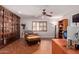 Comfortable home office with floor-to-ceiling bookshelves and natural light at 5402 E Larkspur Dr, Scottsdale, AZ 85254