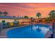 Backyard with a sparkling pool and covered patio area at 5402 E Larkspur Dr, Scottsdale, AZ 85254