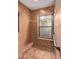 Tiled shower with built-in bench, window, and mosaic accents at 5402 E Larkspur Dr, Scottsdale, AZ 85254