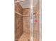Tiled shower with glass doors and showerhead at 5402 E Larkspur Dr, Scottsdale, AZ 85254