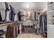 Walk-in closet with organized hanging racks, open shelving, and convenient storage for clothing and accessories at 5402 E Larkspur Dr, Scottsdale, AZ 85254
