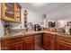 Stylish wet bar with custom cabinets, mini-fridge, and tiled backsplash at 5402 E Larkspur Dr, Scottsdale, AZ 85254