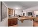 Convenient wet bar area featuring wooden cabinets, a sink, and plenty of counter space at 5402 E Larkspur Dr, Scottsdale, AZ 85254