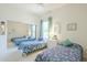 Bedroom featuring two beds, soft carpeting, a large mirror, and natural lighting at 7486 E Bajada Rd, Scottsdale, AZ 85266