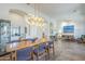Open dining room with modern light fixture and direct view to the living room at 7486 E Bajada Rd, Scottsdale, AZ 85266