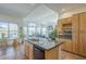 Open concept kitchen with island, black appliances, and breakfast nook area at 7486 E Bajada Rd, Scottsdale, AZ 85266