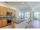 Spacious kitchen with island, breakfast bar, stainless appliances, and large window view at 7486 E Bajada Rd, Scottsdale, AZ 85266