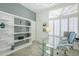 Bright office space with built-in shelving, lots of natural light, and modern decor at 7486 E Bajada Rd, Scottsdale, AZ 85266