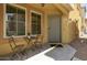 Welcoming entrance with a cozy outdoor seating arrangement, perfect for enjoying the neighborhood ambiance at 7722 W Pipestone Pl, Phoenix, AZ 85035