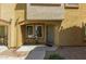 Inviting front entrance with covered porch and charming seating area for relaxing and welcoming guests at 7722 W Pipestone Pl, Phoenix, AZ 85035