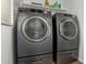 A laundry room featuring a front loading washing machine and dryer at 7722 W Pipestone Pl, Phoenix, AZ 85035
