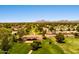 Beautiful aerial view of the community showing mature trees, green spaces, and mountain views at 8943 N 80Th Pl, Scottsdale, AZ 85258