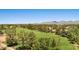 Scenic aerial view of community park with soccer field, green spaces, and mountain views at 8943 N 80Th Pl, Scottsdale, AZ 85258