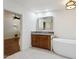 Bright bathroom featuring granite countertops, wood cabinets, and soaking tub at 8943 N 80Th Pl, Scottsdale, AZ 85258