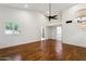 Large bedroom with wood floors, and a ceiling fan and an ensuite bath at 8943 N 80Th Pl, Scottsdale, AZ 85258