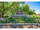 Beautifully landscaped McCormick Ranch community entrance with colorful flowers and lush greenery at 8943 N 80Th Pl, Scottsdale, AZ 85258