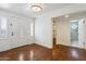 Bright entryway boasts natural light, hardwood floors, and views to an adjacent room with tiled shower at 8943 N 80Th Pl, Scottsdale, AZ 85258