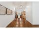 Bright hallway with wood floors leading to an open kitchen at 8943 N 80Th Pl, Scottsdale, AZ 85258