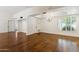 Well-lit living area with hard wood floors, neutral walls, and modern lighting at 8943 N 80Th Pl, Scottsdale, AZ 85258