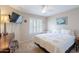 Comfortable bedroom with plantation shutters, ceiling fan, and neutral color scheme at 9128 W Kimberly Way, Peoria, AZ 85382