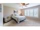 Relaxing bedroom with ample natural light, ceiling fan, and neutral color scheme at 9128 W Kimberly Way, Peoria, AZ 85382
