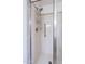 Updated bathroom shower with adjustable shower head, grab bar, and built-in storage rack at 9128 W Kimberly Way, Peoria, AZ 85382