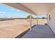 Backyard patio with an expansive lot and picturesque landscape views at 9280 W Wenden Dr, Arizona City, AZ 85123