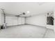 Spacious garage with an automatic door opener, water heater, and ample storage space at 9280 W Wenden Dr, Arizona City, AZ 85123