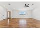 Open concept living room with hardwood floors, natural light, and modern fixtures at 9280 W Wenden Dr, Arizona City, AZ 85123