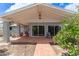 Back patio with pavers and neutral paint, creating a relaxed and charming outdoor living area at 100 E Geneva Dr, Tempe, AZ 85282