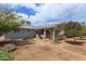 Expansive backyard featuring a built-in grill, providing an ideal space for outdoor entertaining and relaxation at 100 E Geneva Dr, Tempe, AZ 85282
