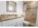 Bathroom featuring granite counters, updated shower with custom tile, and white vanity at 100 E Geneva Dr, Tempe, AZ 85282